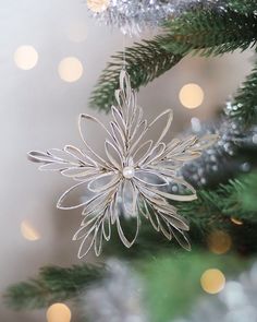 a christmas ornament hanging from the top of a tree