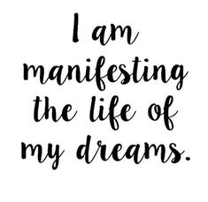 the words i am manifesting the life of my dreams in black and white