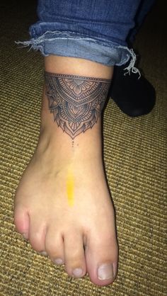 a person with a tattoo on their foot