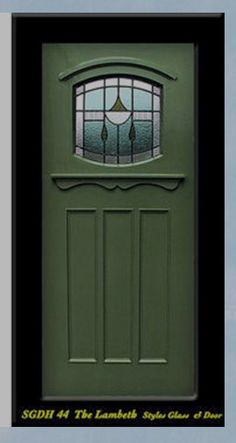 a green front door with two windows