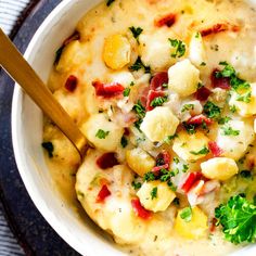 a white bowl filled with food on top of a table