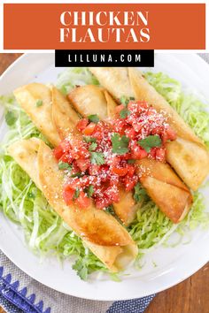 chicken flauas on a plate with lettuce and tomato salsa in the middle