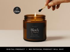 a person lighting a candle in a jar with the words black orchid written on it