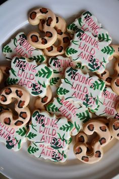 some decorated cookies are on a white plate