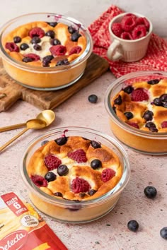 two dessert dishes with berries and cream on top