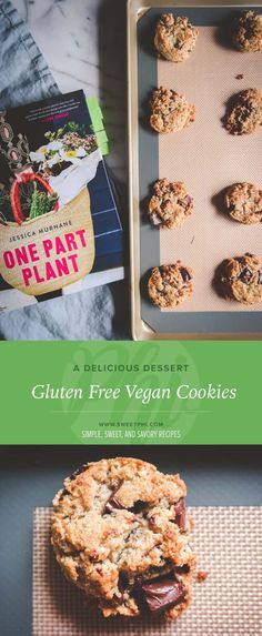 a cookie on a baking sheet next to a tray of cookies and a cookbook