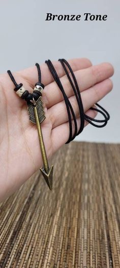 "Arrow Symbol Necklace, handmade Design. Unisex Necklace. Arrow Symbol Meaning The meaning of the arrow indicated protection and defense. Arrows also signified direction, force, movement, power and direction of travel. Dimensions: Arrow Pendant: 2.25\" Inches long Adjustable Necklace With Sliding knots. Adjust from 16\" Inches up to 30\" Inches Around the Neck. Wear it as a choker or long necklace. FAST SHIPPING! Visit my Etsy Shop to see more Arrow Designs! Handmade Arrow Necklaces and Arrow Ea Arrow Symbol Meaning, Arrow Designs, Arrow Symbol, Turtle Bracelet, Arrow Earrings, Arrowhead Necklace, Arrow Pendant, Symbol Necklace, Turtle Earrings