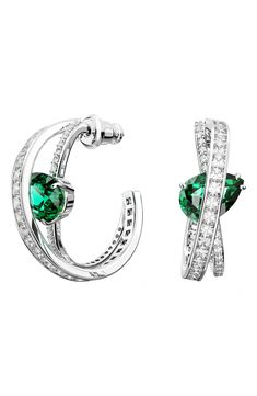 Go glam in crisscross hoop earrings alight with brilliant crystals and punctuated with a single green, pear-shaped crystal. 1 1/4" hoop diameter; 1/8" width Rhodium plate/Swarovski crystal Imported Popular Earrings, Tiffany Necklace, Medium Hoop Earrings, Tiffany Jewelry, Diamond Jewelry Designs, Crystal Hoop Earrings, Emerald Earrings, Gold Plated Bracelets, Swarovski Earrings