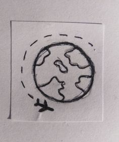 a drawing of an airplane flying over the earth on white paper with black marker writing