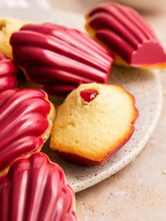 some red and yellow cookies on a plate