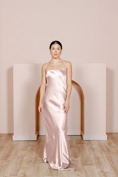 Our strapless Leo satin dress will become a staple silhouette for weddings. This satin dress features a mesmerizing detail with a cowl drape back that creates a keyhole effect on the back of the dress and is finished off with faux, dainty buttons. Revelry Dresses, Wedding Parties Colors, Simple Skirt, Bridesmaid Dress Colors, Dress Silhouette, Satin Dress, Bra Cups, Modern Wedding, Dress Backs