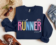 In My Runner Era Sweatshirt, Funny Runner Sweater and Hoodie, Funny Marathon Athlete Sweatshirt, Fitness Running Mom, Sweater for Runner, Gift For Women Welcome to my store! I will help you to have a good shopping experience as much as I can. If you have any request (design customization, more size and color options) please feel free to message me. I will reply as soon as possible. I have listed some information to help you below:  HOW TO ORDER  * Please, Check and Review all Photos. * Select Your Sweatshirt Color from drop down menus. * Choose Your Quantity as much as you want. * Click ADD TO CART. And, you can go back to add more product color for your family members and text colors or You can complete the checkout process.  CARE INSTRUCTIONS  For best results, wash inside out and lay fl Multicolor Cotton Sports Sweatshirt, Multicolor Crew Neck Sweatshirt For Sports, Sporty Multicolor Letter Print Sweatshirt, Runner Humor, Running Mom, Mom Sweater, Etsy Ideas, Funny Sweatshirts, Gift For Women