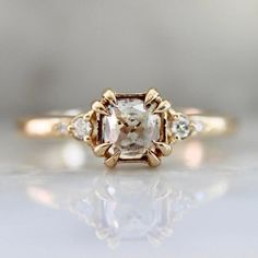 an engagement ring with a white diamond in the center