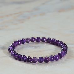 Welcome to our Beautiful Natural Purple Amethyst Stone Bracelet! This stunning Amethyst Armband is ideal for women who love stylish and meaningful jewelry. Each and every one of this bracelet is made of real Amethyst, a powerful crystal known for its healing properties and beautiful purple color. This Bead Amethyst Jewelry makes a thoughtful gift for birthdays, anniversaries or any special occasion. Surprise your loved ones with a unique and meaningful piece of jewelry that they can keep for yea Amethyst Crystal Bracelet, Amethyst Healing, Bracelet Bead, Men Bracelet, Crystal Healing Bracelets, Dainty Bracelet, Women Bracelet, Meaningful Jewelry, Amethyst Jewelry