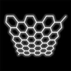 the outline of a hexagonal structure on a black background with white lines in it