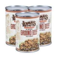 three cans of ground beef on a white background