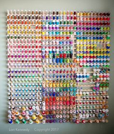 an art work made out of buttons and thread