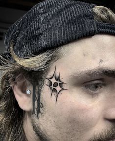 a man with a cross tattoo on his forehead