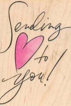 the words sending to you are written on a piece of wood with a pink heart