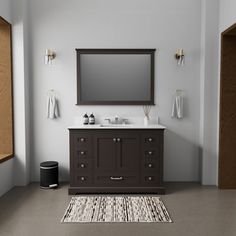 a bathroom with a sink, mirror and rug