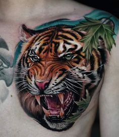 a man with a tiger tattoo on his chest