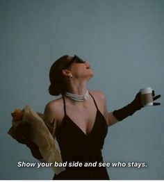 a woman in a black dress holding a coffee cup and paper bag with the words show your side and see who stays