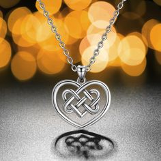 Our Eternal Love Knot 925 Sterling Silver Necklace is a timeless symbol of everlasting love and unity. Crafted with precision and love, this exquisite piece showcases the enduring beauty of the Celtic love knot design. Let its intricate details and rich symbolism captivate your heart and soul. Significance: Enduring Love: The Eternal Love Knot represents an unbreakable bond, an eternal connection that transcends time and distance. It is a constant reminder of the enduring love between two souls, making it an ideal gift for cherished partners, family members, or close friends. Unity and Harmony: The interwoven strands of the love knot symbolize the intertwining of lives and spirits. It reflects the harmony and unity in profound, meaningful relationships, fostering a sense of togetherness an Elegant Heart Pendant Jewelry For Promise, Symbolic Jewelry For Valentine's Day Anniversary, Symbolic Heart Shaped White Gold Jewelry, Symbolic Promise Jewelry For Valentine's Day, Symbolic Jewelry For Promise On Valentine's Day, Elegant Necklaces With Intricate Design For Valentine's Day, Elegant Necklaces For Mother's Day Promise, Elegant Necklace For Mother's Day Promise, Symbolic Jewelry For Anniversary And Mother's Day