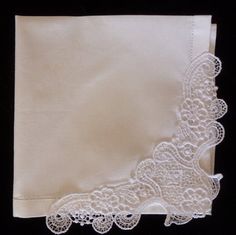 Brand New!These are beautiful cotton hemstitched hankies that I embellish with created lace - an Initial Impressions exclusive.  Perfect for the bride, mother of the bride or groom and a gorgeous gift for the bridesmaids, these are more special than the routine bridal hankie!The hankie is 12" x 12", appropriate for a lady's hankie and  very soft and supple cotton with a wonderful "hand"The lace on the corner measures approximately 8 inches across and  3 inches from the top of the bow to the tip Elegant White Handkerchiefs With Lace Work, Elegant White Handkerchiefs With Crochet Lace, Elegant Lace Handkerchiefs With Lace Trim, Elegant White Lace Handkerchiefs, Classic White Lace Work Handkerchiefs, Classic White Lace Handkerchief, Classic White Lace Handkerchiefs, Elegant White Handkerchiefs With Machine Embroidery, White Embroidered Lace Handkerchiefs