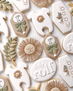 decorated cookies are arranged on top of each other in different shapes and sizes, including one for the baby's first year