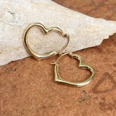 10KT yellow gold polished open heart hoop earrings in medium size. We carry 3 sizes of this style earring- this is the middle size. Measures: 22mm x 19mm Thickness: 3mm Hollow Finished on all sides Weight: .65g Hoop Earrings Medium, Saint Jewelry, Heart Hoop Earrings, Hoop Design, Basic Design, Fabric Ribbon, Open Heart, Gold Polish, Jewelry Earrings Hoops