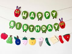 a happy birthday banner with fruits and vegetables on it