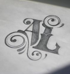 the letter j is made up of swirls and letters that are drawn on paper