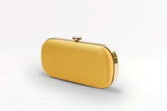 The Limoncello Yellow Bella Clutch is a bold yellow bridal handbag, crafted with duchess satin by Italian artisans featuring a lively pop of color. Planning a maximalist wedding day or looking to make a powerful statement at your next gala? Inspired by Italy’s Amalfi Coast, a coastline featuring terraced vineyards and cliffside lemon groves, this luxury handbag will make a statement on your wedding day, at a red-carpet affair, or on a tropical destination trip. First seen on celebrity stylist Mi Chic Yellow Rectangular Clutch, Chic Yellow Clutch For Formal Occasions, Elegant Yellow Gold Evening Bag, Classic Yellow Evening Bag, Chic Yellow Clutch For Gift, Classic Rectangular Bags For Gala, Chic Yellow Clutch As Gift, Chic Yellow Clutch As A Gift, Modern Yellow Bags Perfect For Gifts