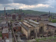 an old factory building in the middle of nowhere