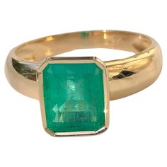 A stunning Natural Colombian Emerald with a nice brilliance, makes it a true classic emerald solitaire ring Primary Stone: 100% Natural Colombian Emerald Shape or Cut: Emerald Cut Emerald Weight: 2.68 Carats (1 emerald) Measurements Emerald: 10.20mm x 8.10mm Average Color: Medium Green Average Clarity: VS Size: 7.25 Total Gemstone Weight: 2.68 carats Setting: Classic Bezel Setting Composition: Yellow Gold 18K Total Ring Weight: 5g Comments: Classic Solitaire Condition: New Emerald Solitaire Ring, Green Diamond Rings, Colombian Emerald Ring, Natural Cushions, Cushion Cut Ring, Emerald Diamond Ring, Colombian Emeralds, Green Diamond, Emerald Cut Diamonds