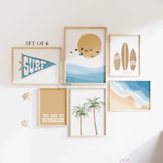 there are many pictures hanging on the wall in this room, including surfboards and palm trees