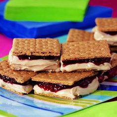 some waffles are stacked on top of each other with cream cheese and jelly