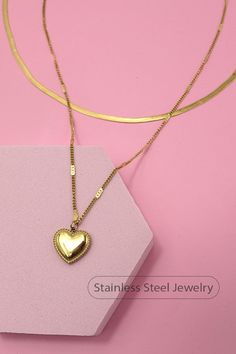 18K Stainless Steel Waterproof Tarnish Free Multi-Layer Heart Charm Necklace, made with stainless steel with a luxurious 18K gold finish, this necklace features multiple layers adorned with delicate heart charms. Its waterproof and tarnish-free properties ensure that it maintains its shine and luster, making it suitable for everyday wear in any conditions. Product Details:length: 16"Charm size: .4"ext: 3" extclasp: Lobster ClawMetal finish: Stainless Steel 18K Goldproduct: Lead & Nickel Complian Gold Heart Shaped Box Chain Jewelry, Gold Snake Chain Necklaces For Valentine's Day, Gold Snake Chain Necklace For Valentine's Day, Gold Snake Chain Jewelry For Valentine's Day, Gold Tarnish Resistant Heart Necklace, Tarnish Resistant Gold Heart Necklace, Gold Heart Pendant Jewelry With Box Chain, Gold Heart Pendant Necklace With Box Chain, Gold Heart Pendant With Box Chain