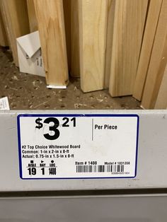 there is a price label on the side of a piece of wood that has been cut in half