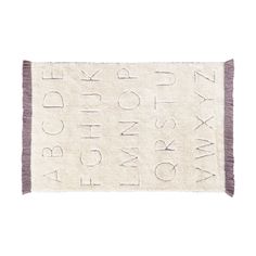 a white rug with letters and numbers on the front, along with a purple border