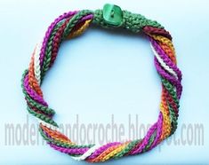 multicolored rope bracelet with green button