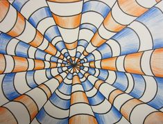 a drawing of an orange, blue and white pattern with circles in the middle on paper