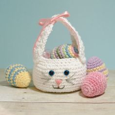 a crocheted basket with an easter bunny inside