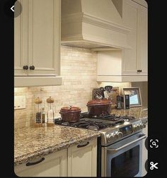 a stove top oven sitting inside of a kitchen