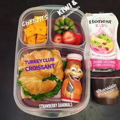 a plastic container filled with different types of food and drinks on top of a table