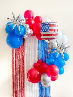 a patriotic fourth of july wreath made out of balloons