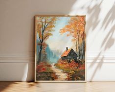 an oil painting on canvas of a house in the woods with autumn foliage and trees