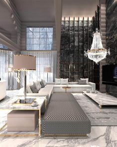 a modern living room with marble walls and flooring, chandelier hanging from the ceiling