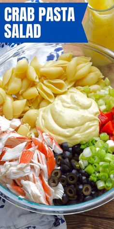 a bowl filled with pasta and vegetables on top of a table