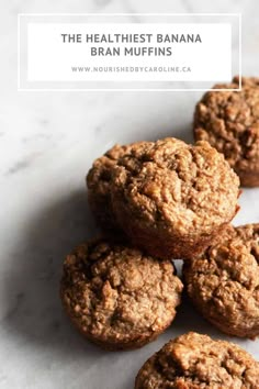 four muffins sitting on top of a white countertop next to each other